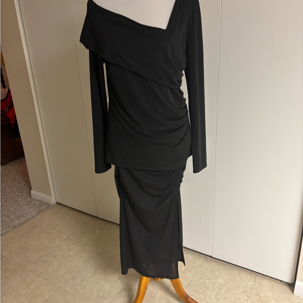 ORIGINAL PRICE $110 NWT TWO PIECE BLACK SPANDEX TOP SIZE XL. AND SKIRT SIZE M